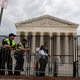 U.S. Capitol Police officers observe an abortion rights rally in front of the U.S. Supreme Court building on May 05, 2022 in Washington, DC. Protestors on both sides of the abortion debate continue to demonstrate following the leaked draft of the Court's potential decision to overturn Roe v. Wade.